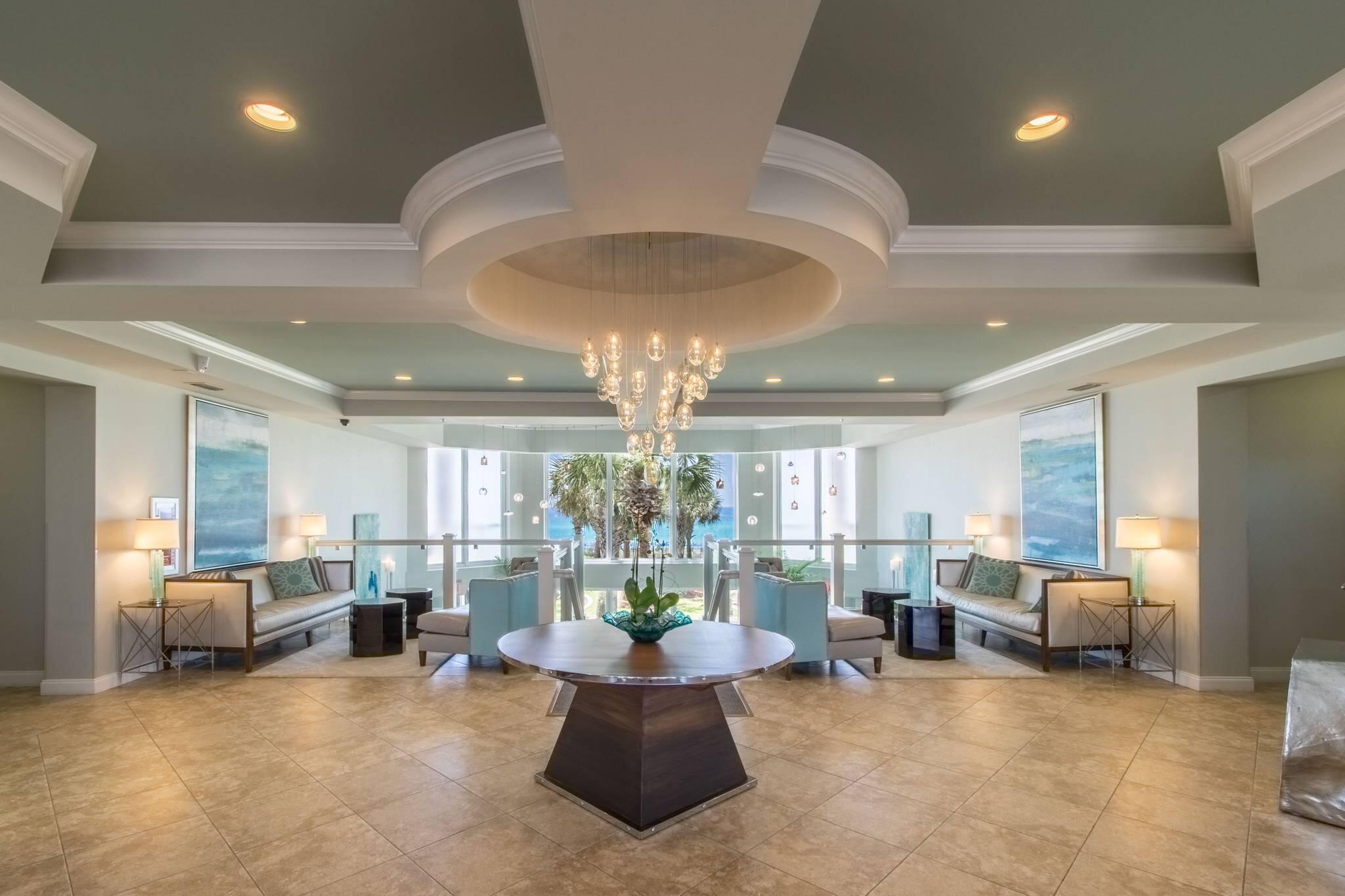 1050 Highway 98, Unit 905E Destin, FL 32541 - Photo 19 of 30 a living room with furniture and a chandelier