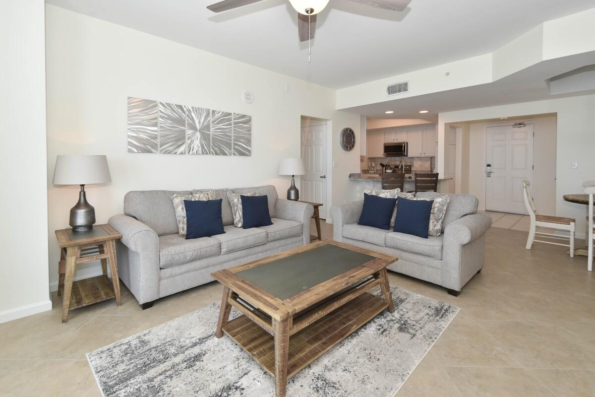 1050 Highway 98, Unit 905E Destin, FL 32541 - Photo 8 of 30 a living room with furniture and a rug