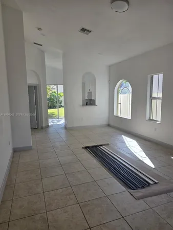 a view of an empty room and window