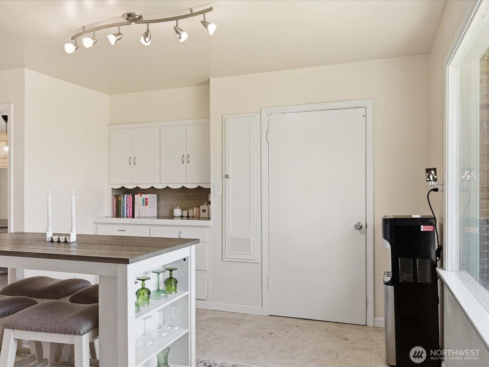 1417 Maple Street Sumner, WA 98390 - Photo 27 of 40 a kitchen with stainless steel appliances granite countertop a white cabinets and a refrigerator