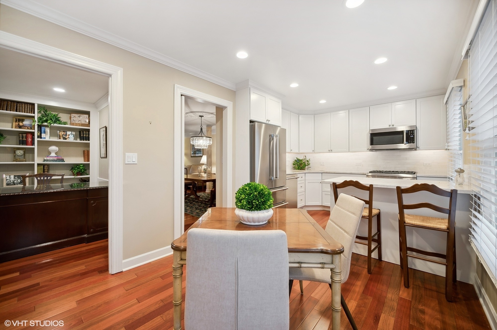 3 Landmark Street Northfield, IL 60093 - Photo 12 of 31 a kitchen with stainless steel appliances kitchen island granite countertop a refrigerator and a stove top oven