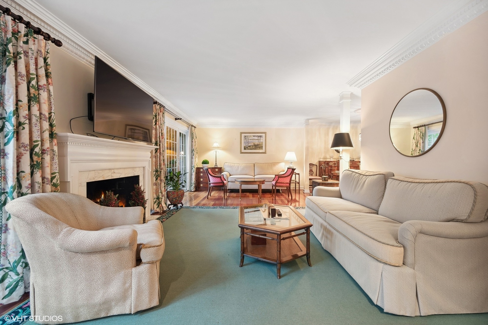 3 Landmark Street Northfield, IL 60093 - Photo 7 of 31 a living room with furniture a fireplace and a large window