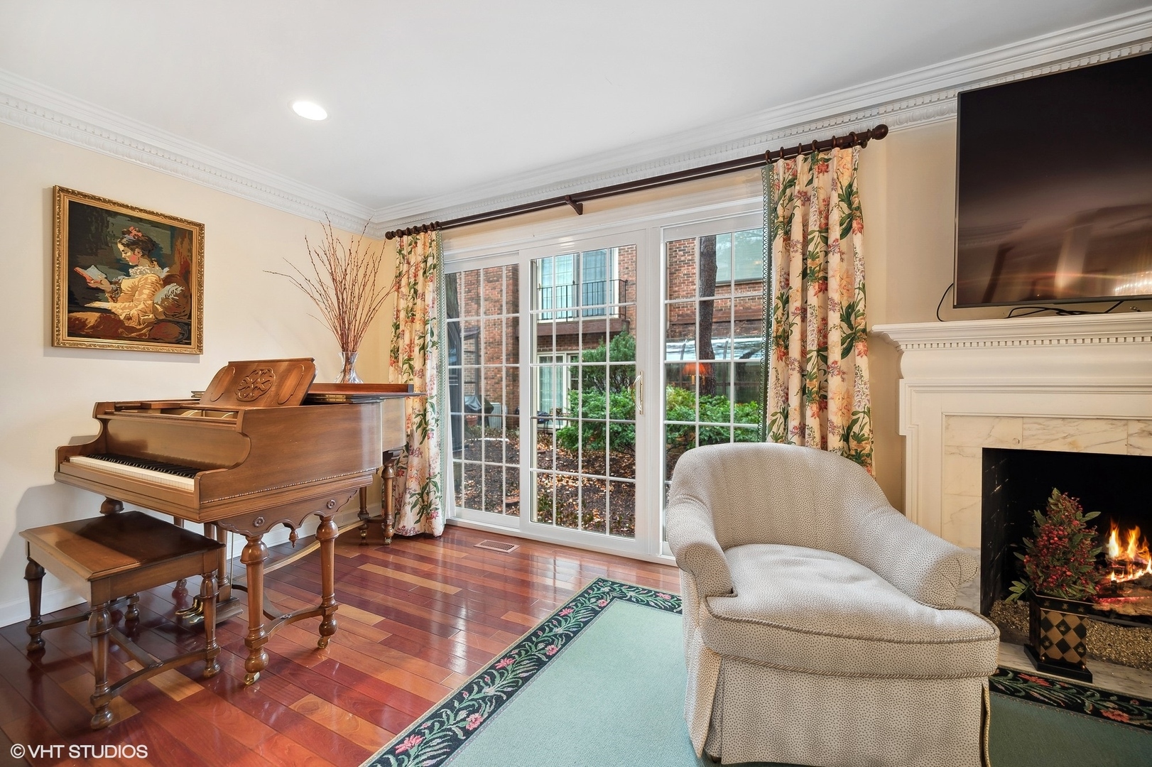 3 Landmark Street Northfield, IL 60093 - Photo 9 of 31 a living room with furniture a flat screen tv and a fireplace