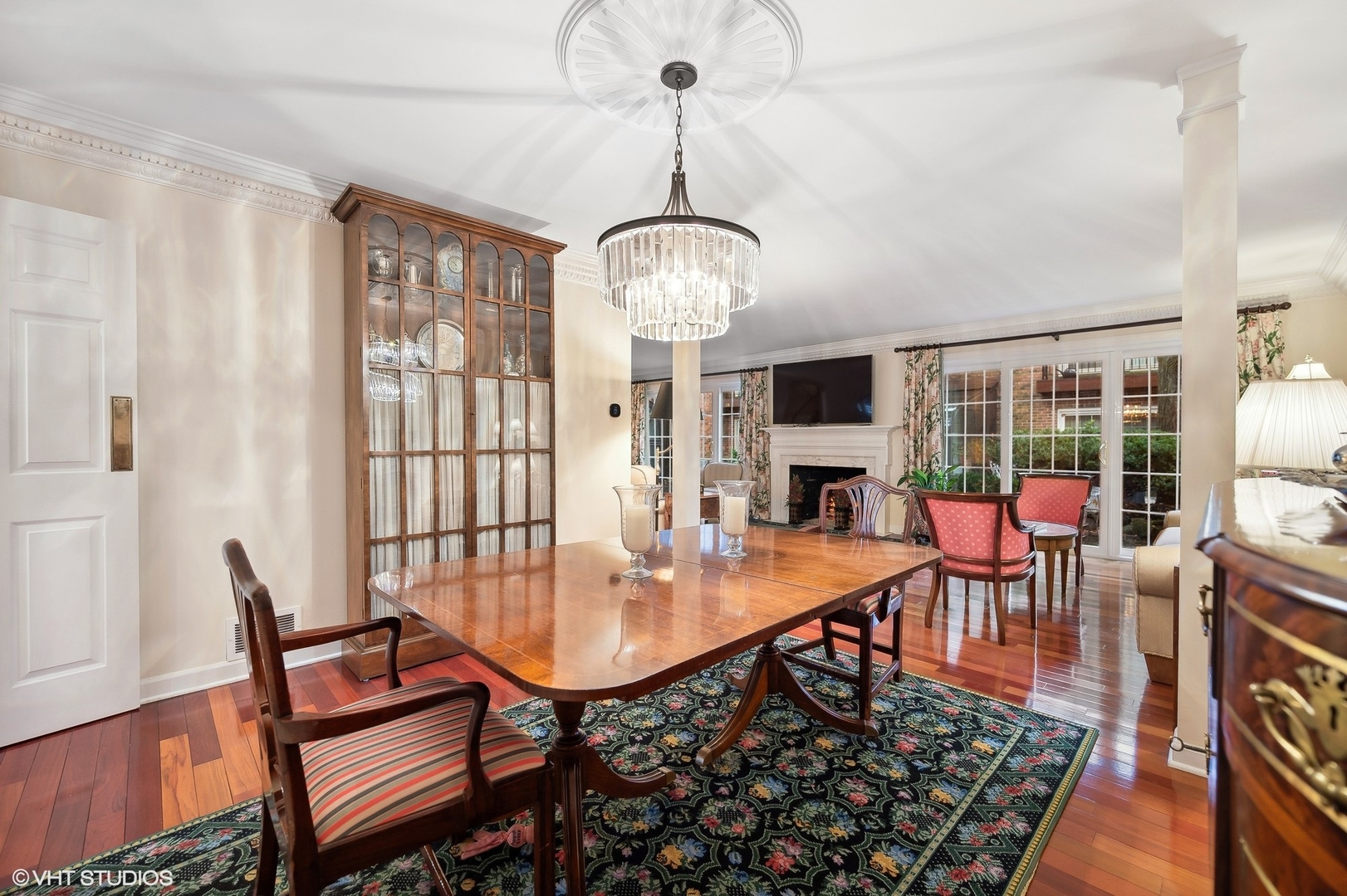 3 Landmark Street Northfield, IL 60093 - Photo 10 of 31 a dining room with wooden floor a chandelier a wooden table and chairs