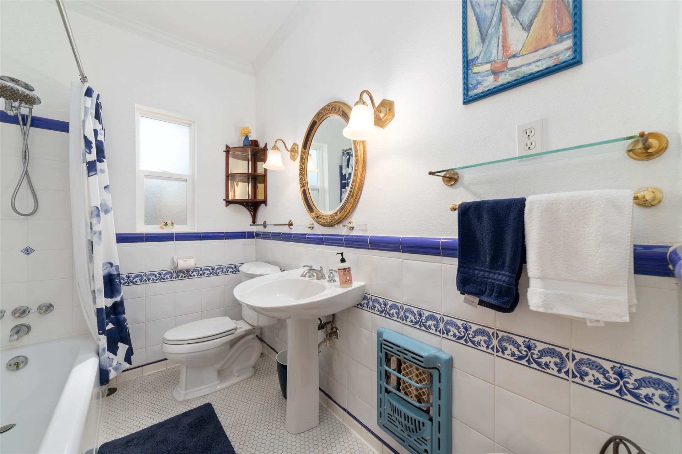 1613 California Street Houston, TX 77006 - Photo 21 of 50 A timeless nod to European craftsmanship, the hall bath features hand-selected Spanish tile, classic porcelain fixtures, and charming vintage details that have been lovingly preserved. Beautiful design never goes out of style.