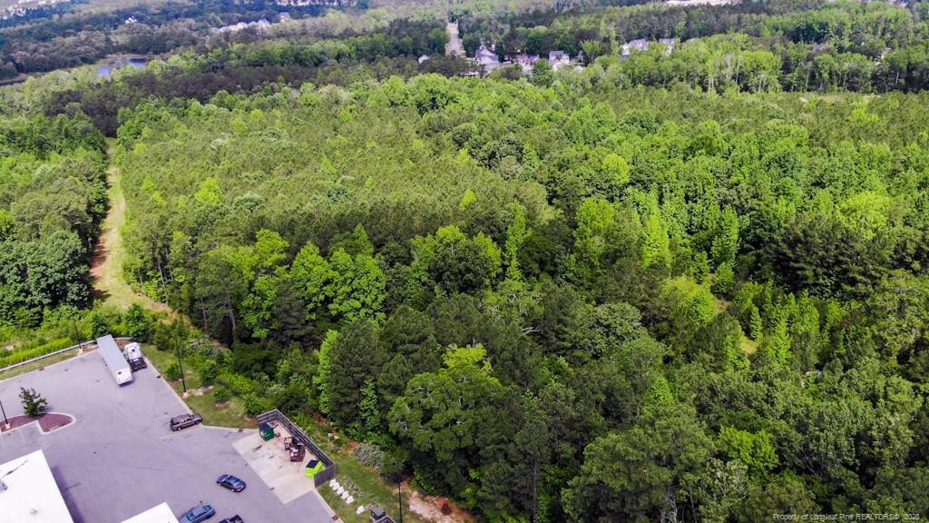 24-87 Nc Cameron, NC 28326 - Photo 22 of 28 an aerial view of residential house with outdoor space and trees all around