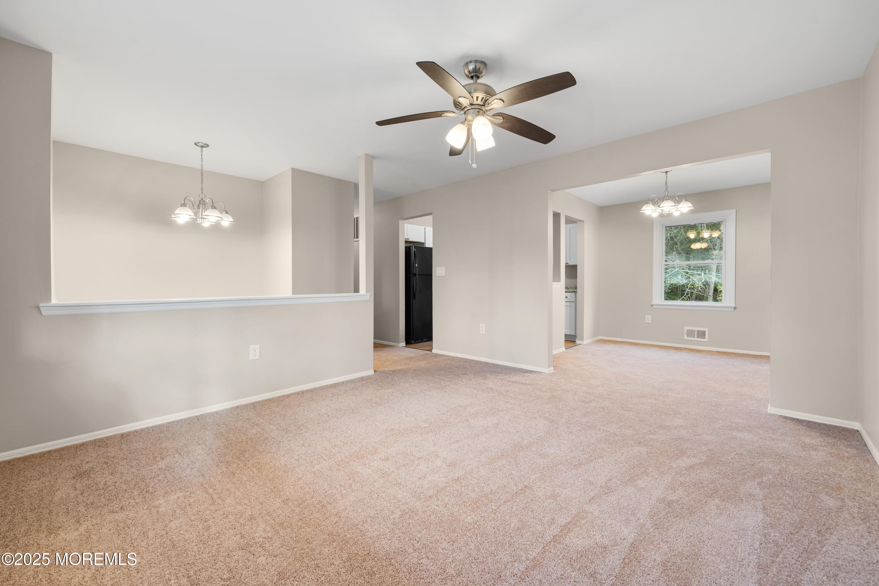 137 Red Bank Avenue Bayville, NJ 08721 - Photo 12 of 24 a view of a livingroom with a ceiling fan and window