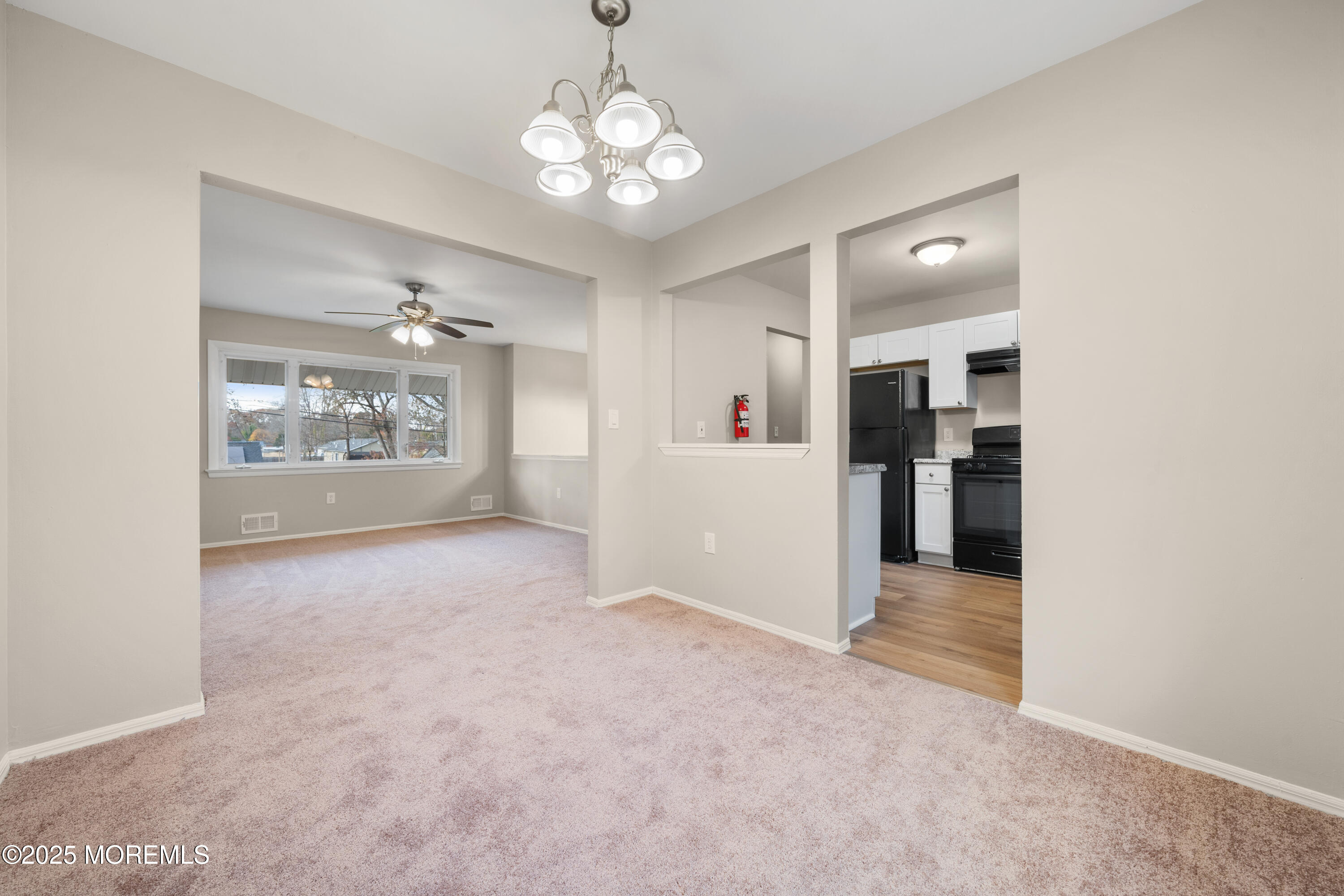 137 Red Bank Avenue Bayville, NJ 08721 - Photo 15 of 24 a view of a big room with windows and chandelier