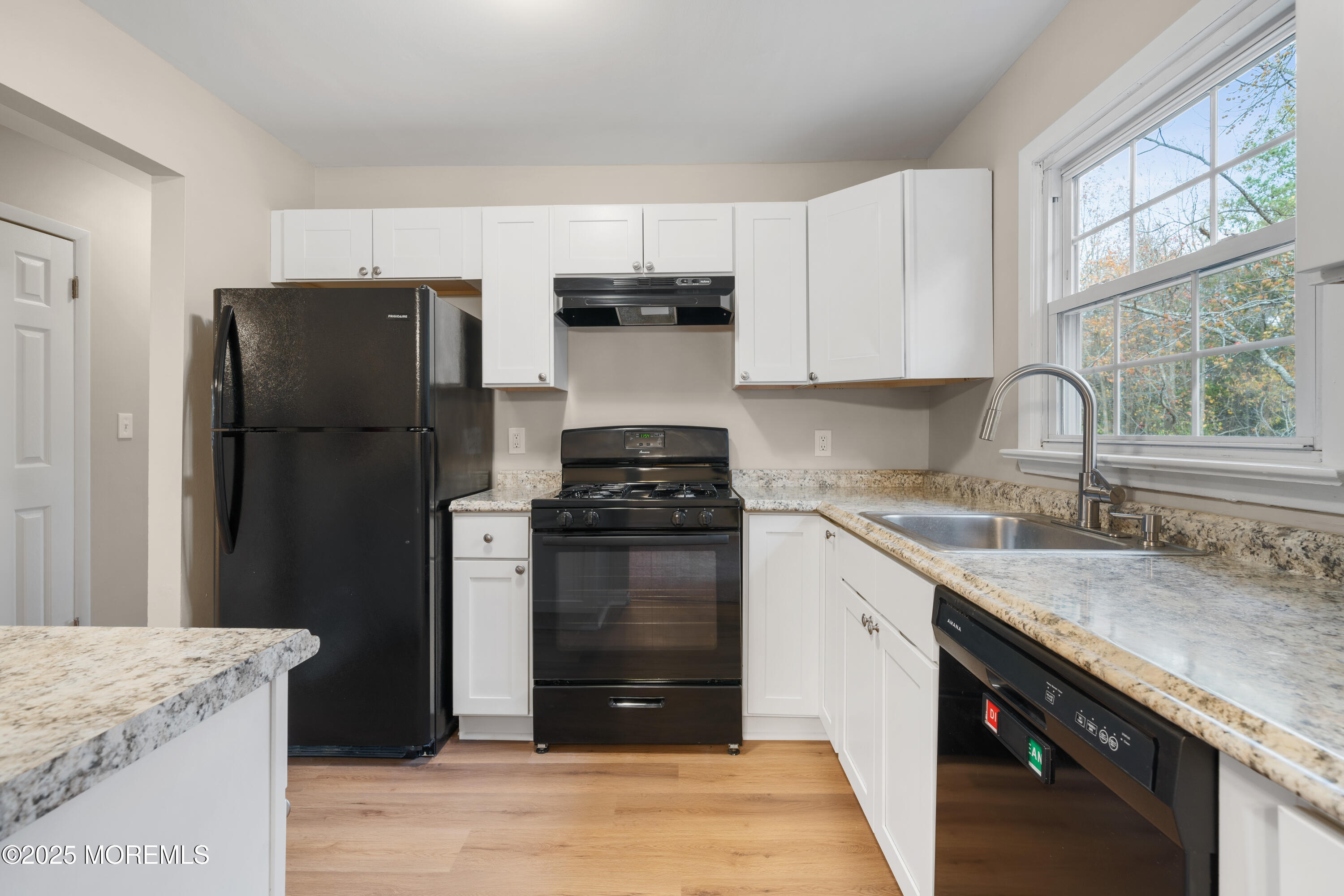 137 Red Bank Avenue Bayville, NJ 08721 - Photo 16 of 24 a kitchen with granite countertop a refrigerator stove and sink