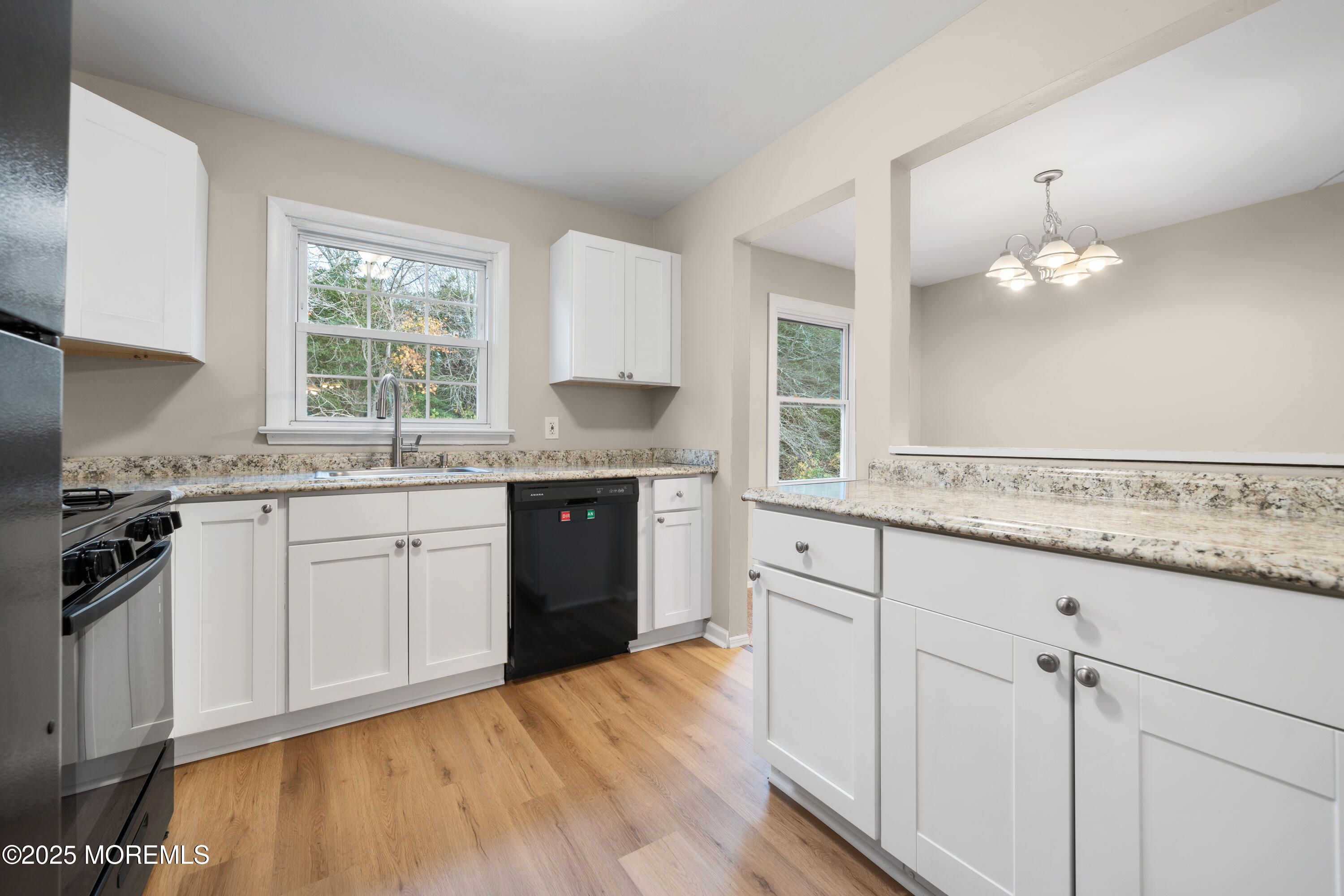 137 Red Bank Avenue Bayville, NJ 08721 - Photo 17 of 24 a kitchen with granite countertop a sink cabinets stainless steel appliances and a window