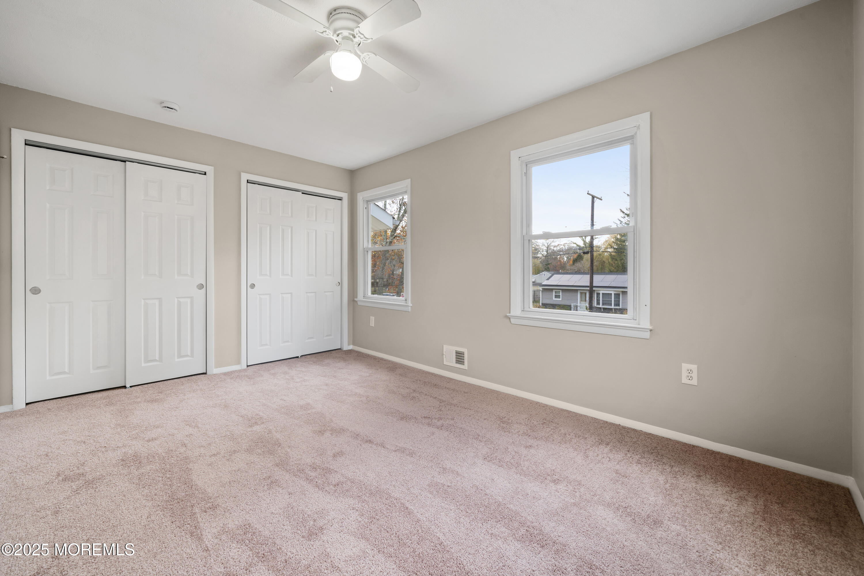 137 Red Bank Avenue Bayville, NJ 08721 - Photo 21 of 24 an empty room with windows and fan