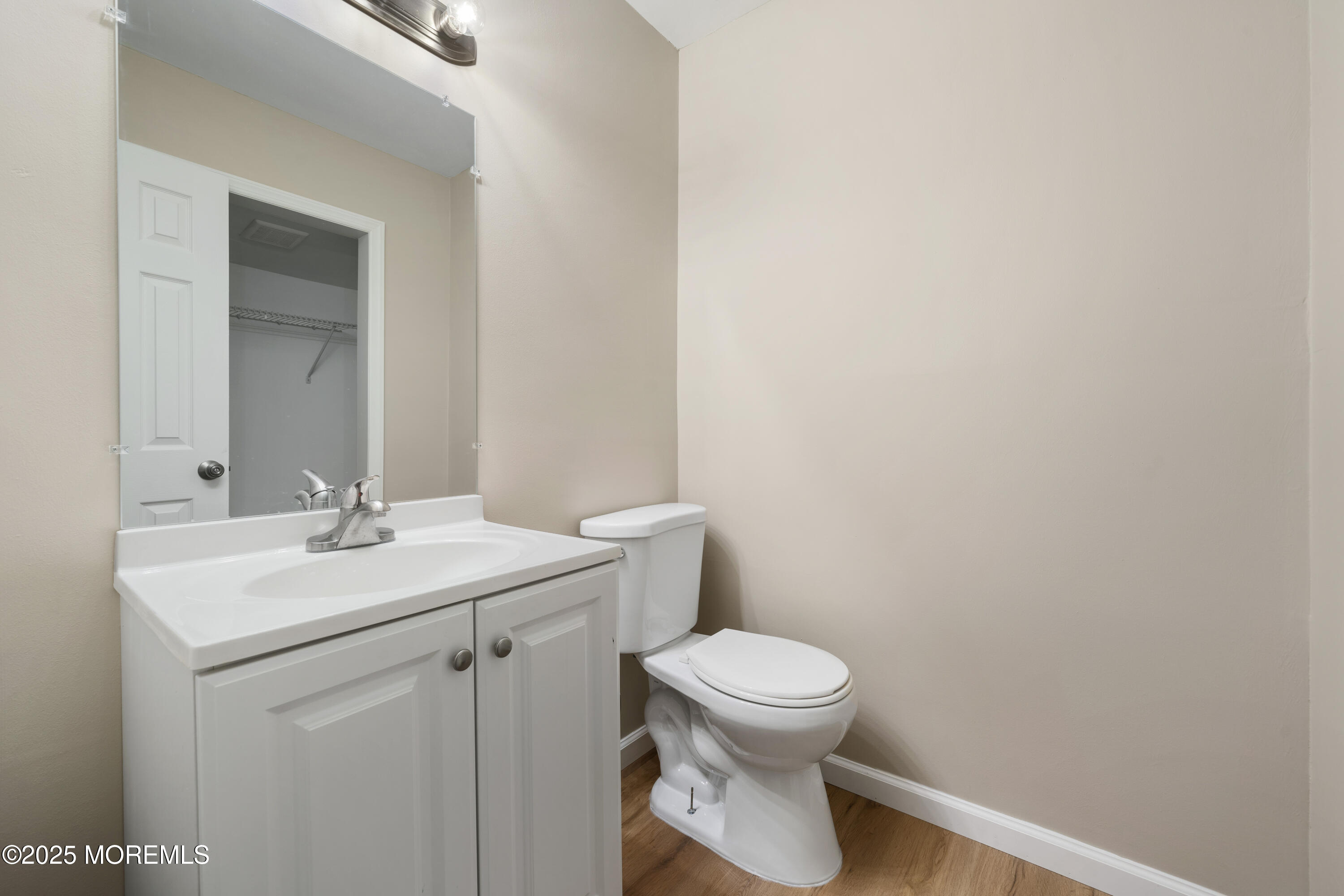 137 Red Bank Avenue Bayville, NJ 08721 - Photo 7 of 24 a bathroom with a sink a toilet and mirror