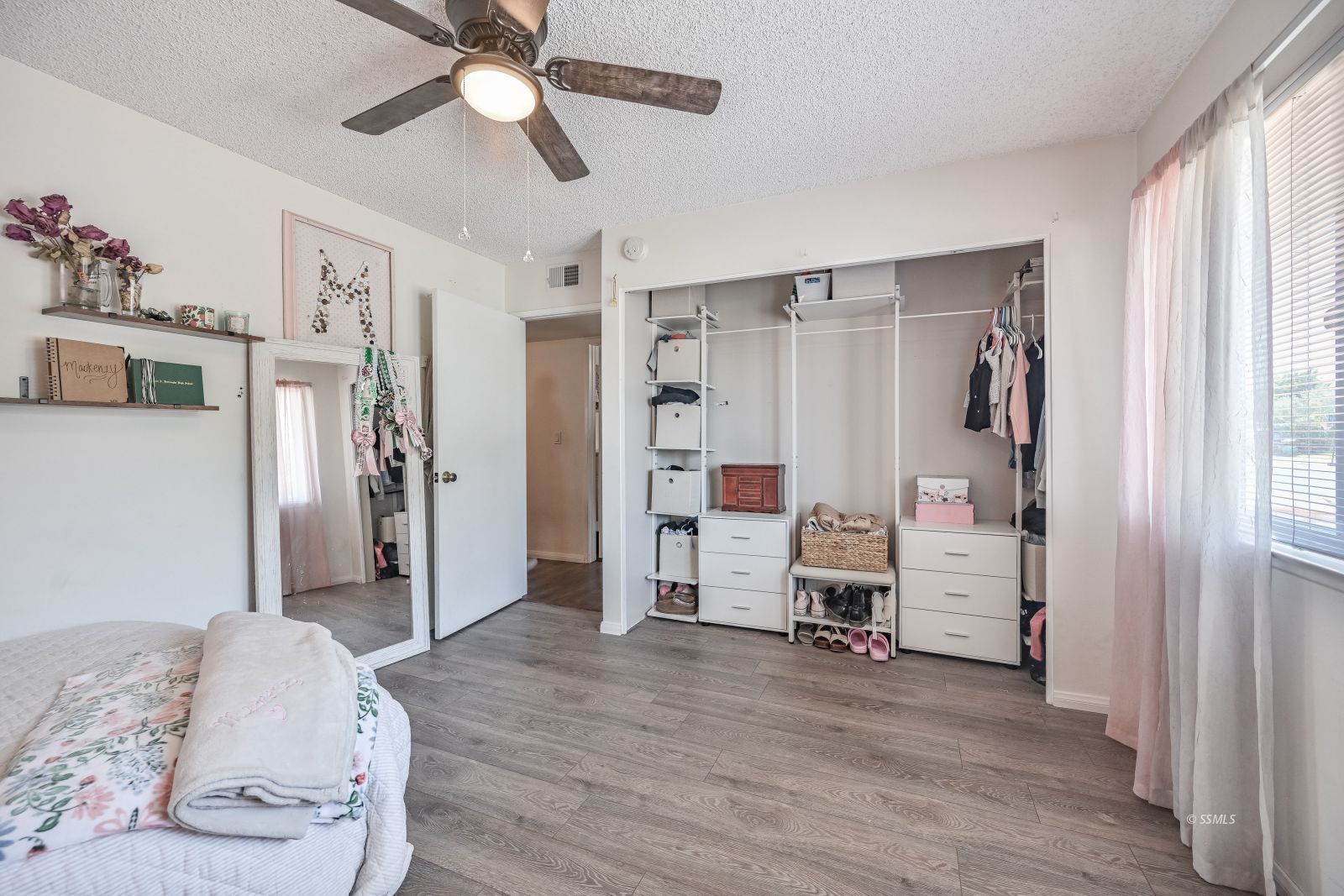 719 Sherri Street Ridgecrest, CA 93555 - Photo 25 of 36 a room with furniture and wooden floor