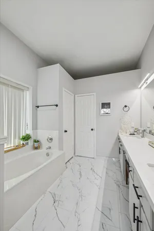 a bathroom with a sink a mirror and a toilet