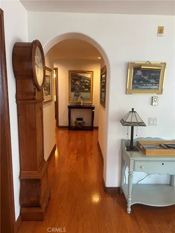 a bedroom with furniture and wooden floor