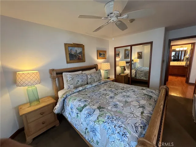 a bedroom with bed and window