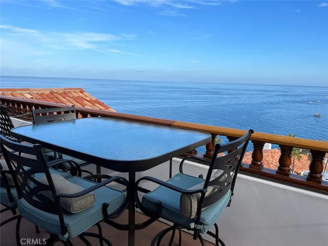 a view of a balcony with chairs