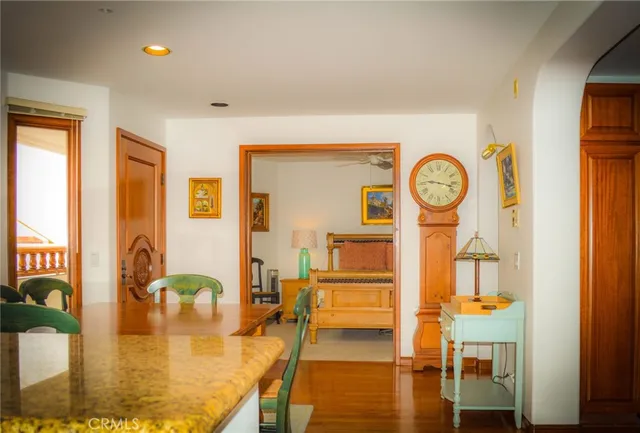 a living room with fireplace furniture and a large window