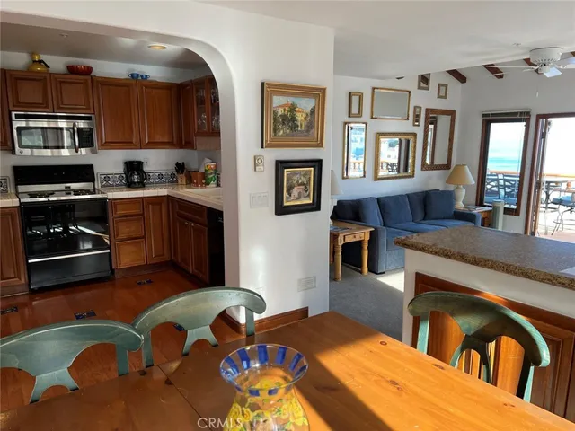 a living room with furniture fireplace and flat screen tv