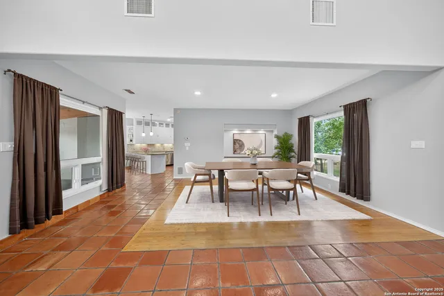 a dining room with a table and chairs