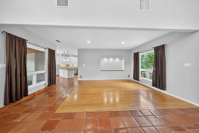 a view of an empty room and window