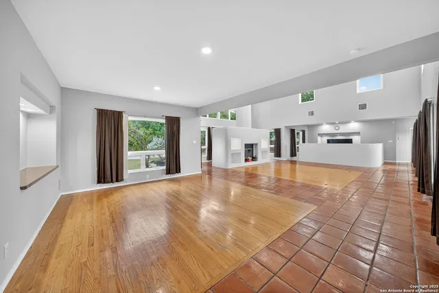 a view interior of kitchen and hall with wooden floor