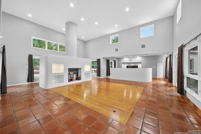 a view of a kitchen with a sink and a fireplace
