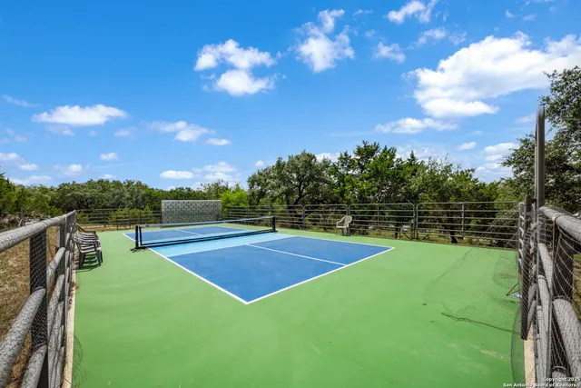 a view of a swimming pool with a yard