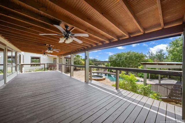 a view of a balcony with wooden floor