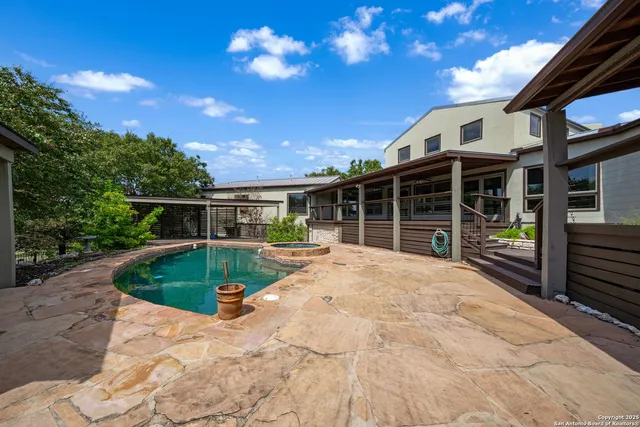 a view of a house with a yard and porch