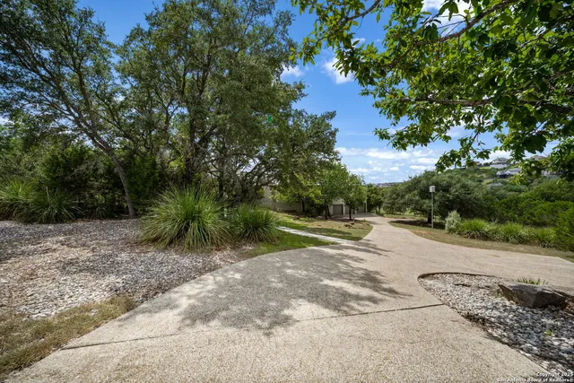a view of a road with a yard