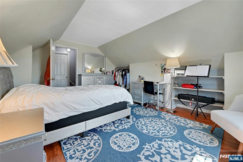 85 Edison Street Clifton, NJ 07013 - Photo 21 of 28 a bed room with a bed and a chair