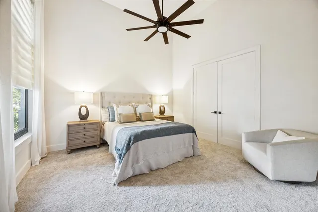 a spacious bathroom with a tub shower and mirror