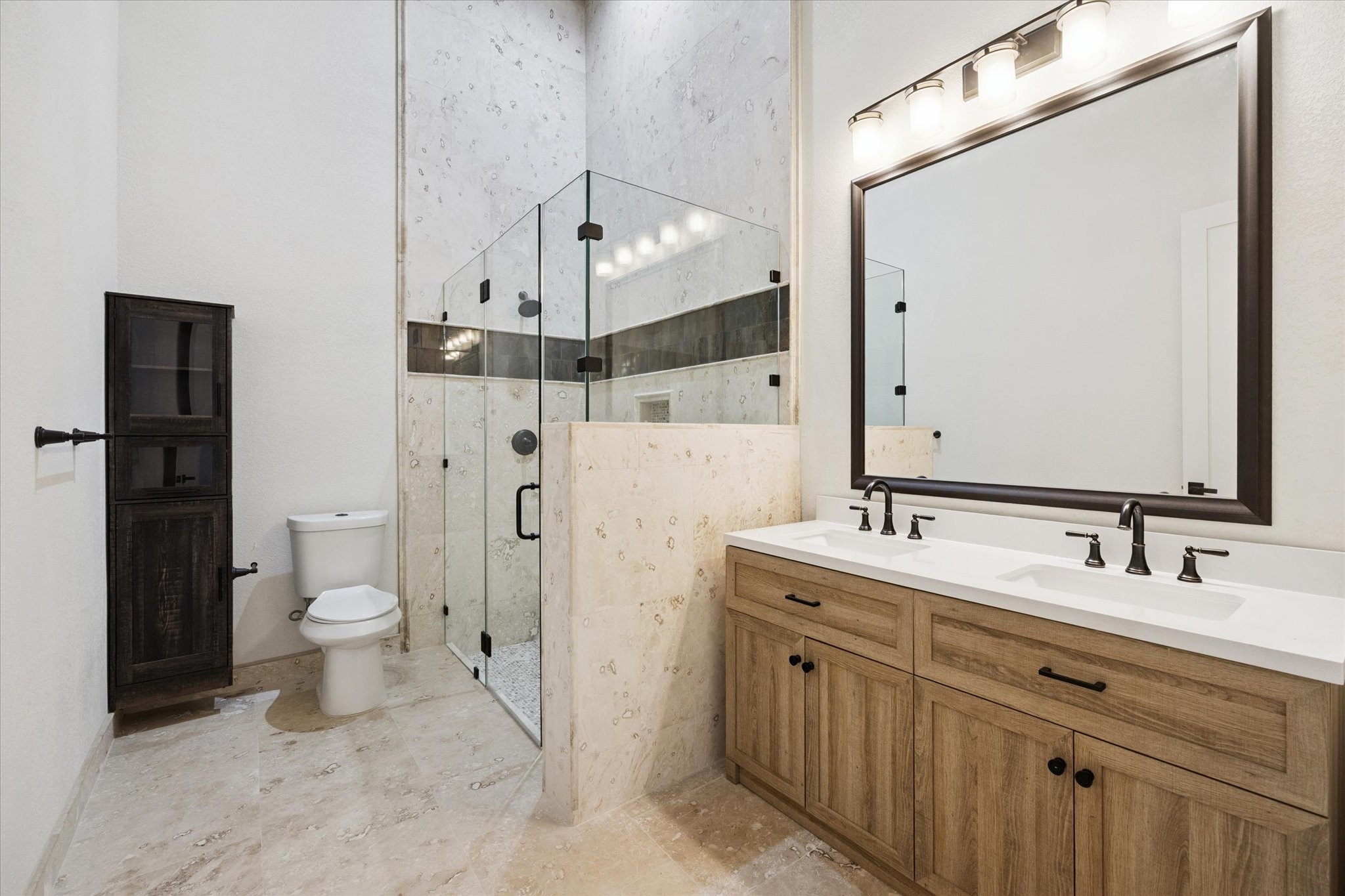 11 River Circle Houston, TX 77063 - Photo 20 of 34 a spacious bathroom with a double vanity sink mirror and toilet