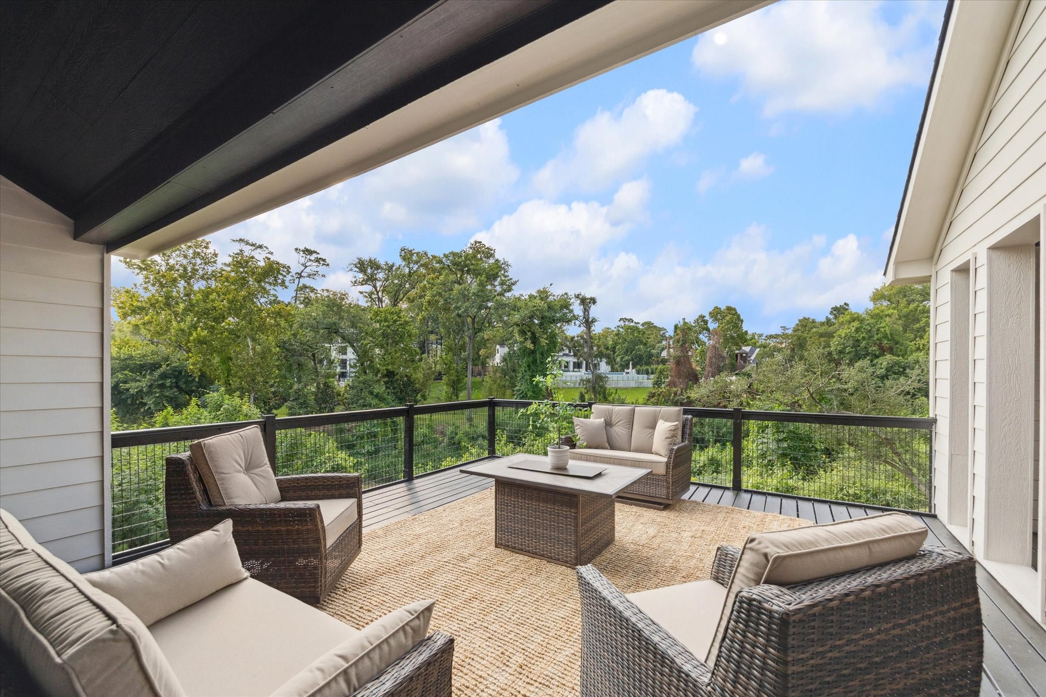 11 River Circle Houston, TX 77063 - Photo 26 of 34 a view of a patio with couches chairs and wooden floor