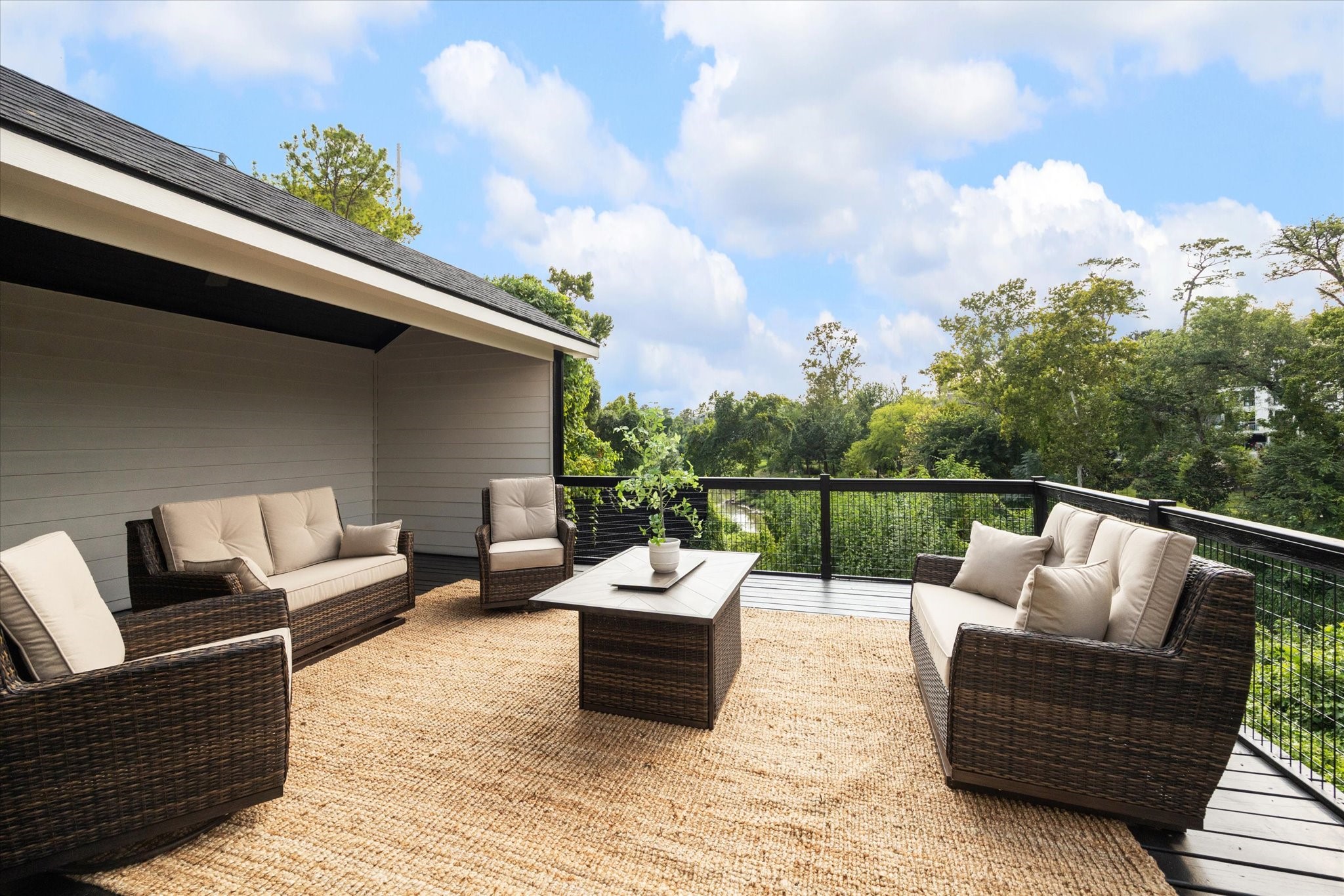 11 River Circle Houston, TX 77063 - Photo 28 of 34 a roof deck with couches and potted plants