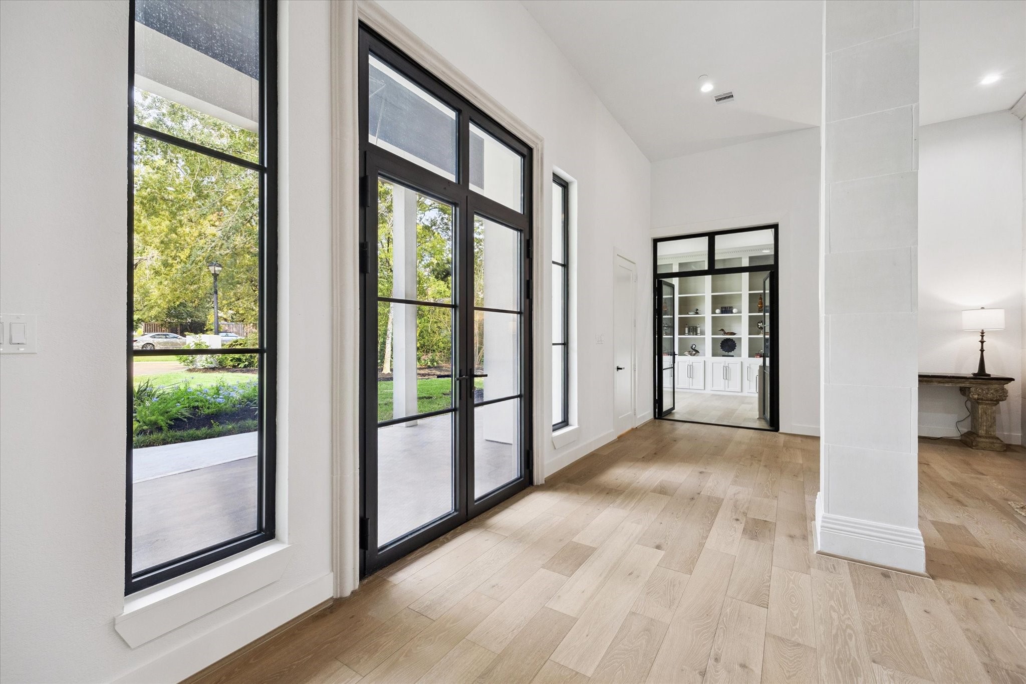11 River Circle Houston, TX 77063 - Photo 2 of 34 a view of a big room with wooden floor and windows