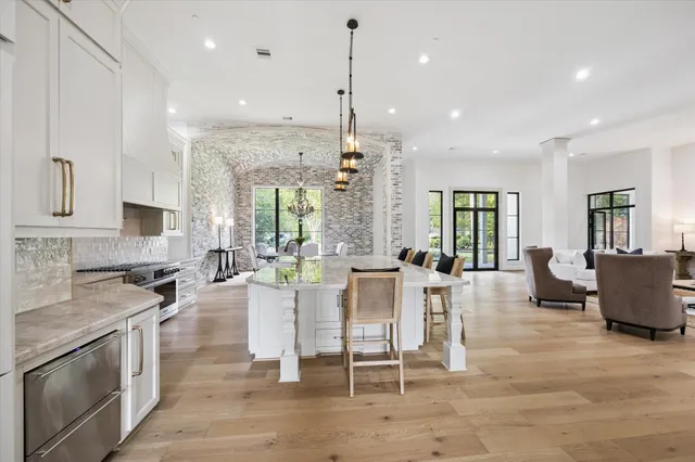 a large kitchen with a table and chairs