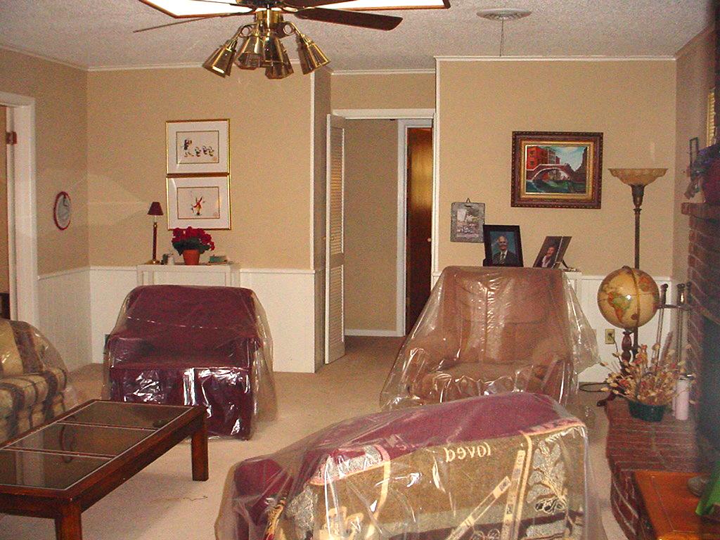 6200 Dreyfuss Road Amarillo, TX 79106 - Photo 3 of 7 a bedroom with furniture and a chandelier