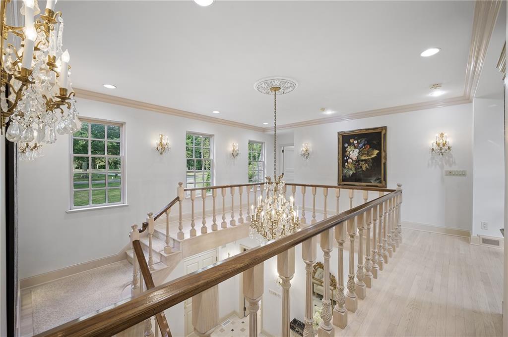 898 Persimmon Road Sewickley, PA 15143 - Photo 31 of 50 A sweeping staircase with carved balusters and elegant wood handrails.