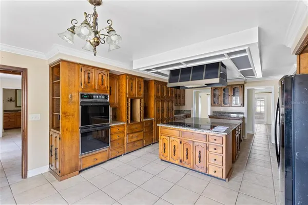 a kitchen with stainless steel appliances granite countertop a stove and a refrigerator