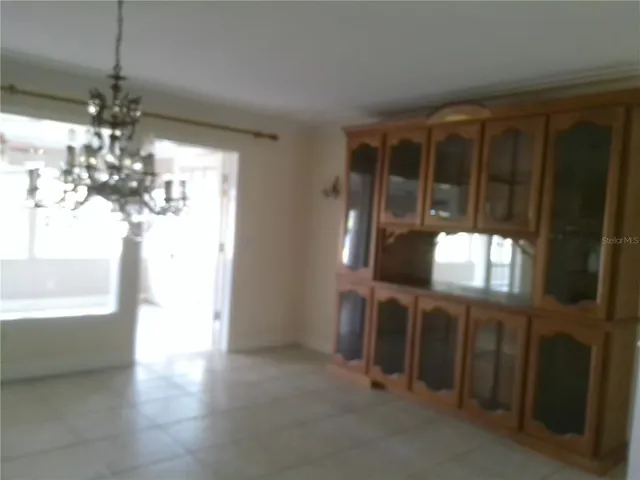 a view of a livingroom with furniture window and wooden floor