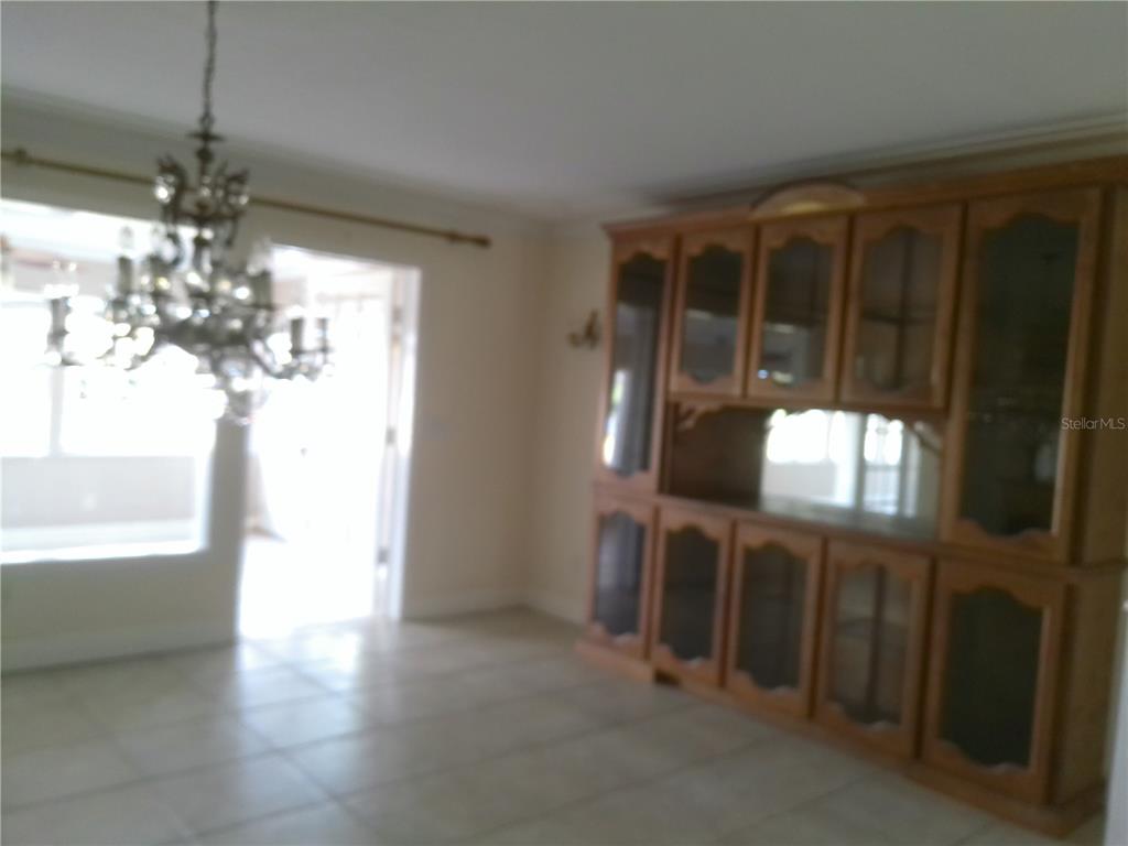 3821 East Osceola Road Geneva, FL 32732 - Photo 16 of 37 a view of a livingroom with furniture window and wooden floor