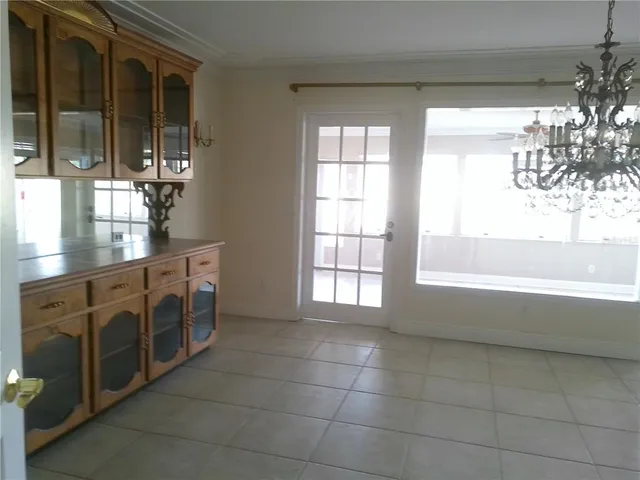 a spacious bathroom with a double vanity sink a large mirror and a bathtub