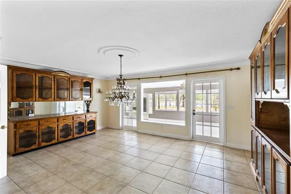 a view of a electric appliances and chandelier in a room