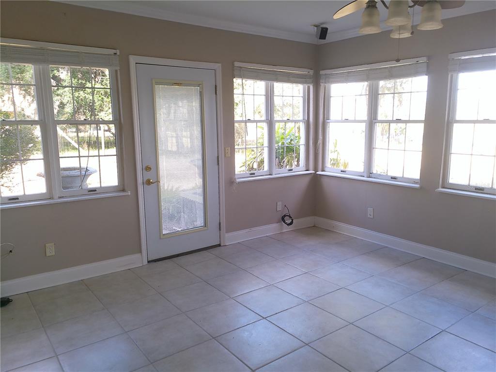 3821 East Osceola Road Geneva, FL 32732 - Photo 19 of 37 an empty room with windows