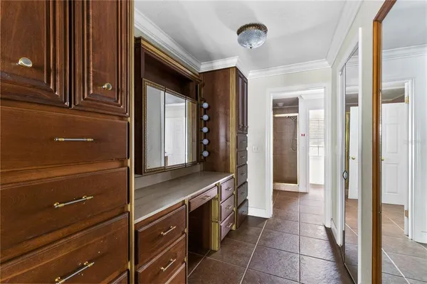 a hallway with a sink and a refrigerator