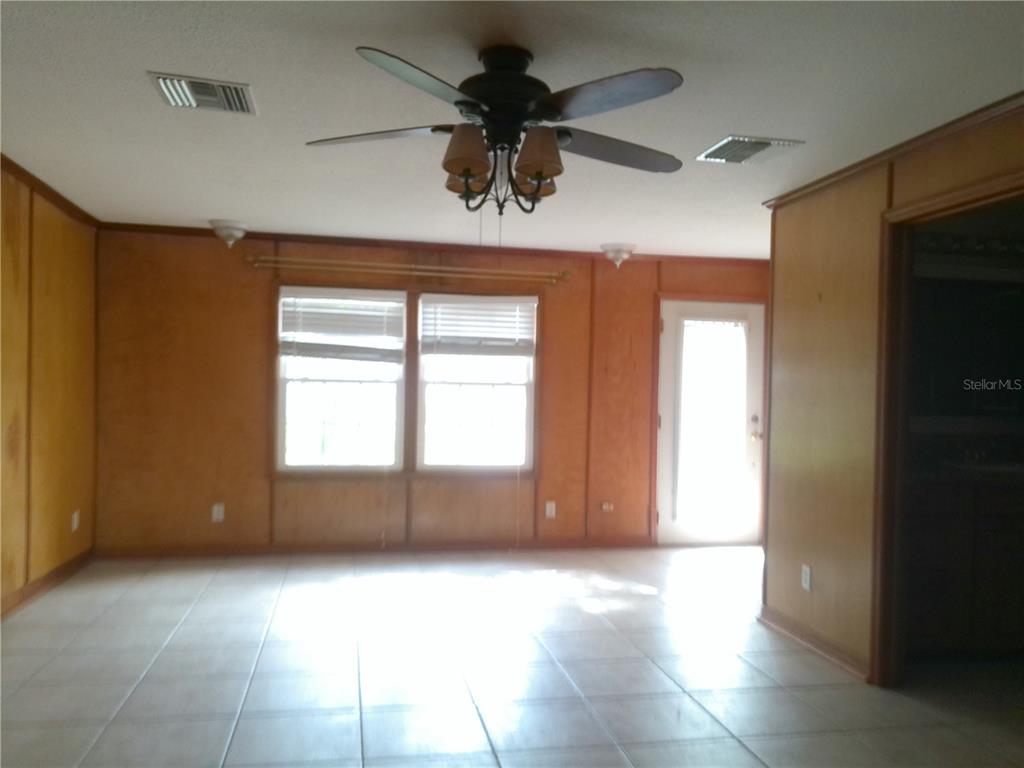 3821 East Osceola Road Geneva, FL 32732 - Photo 25 of 37 a view of room with a ceiling fan and window