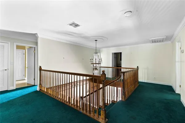 a view of a porch with wooden floor and windows