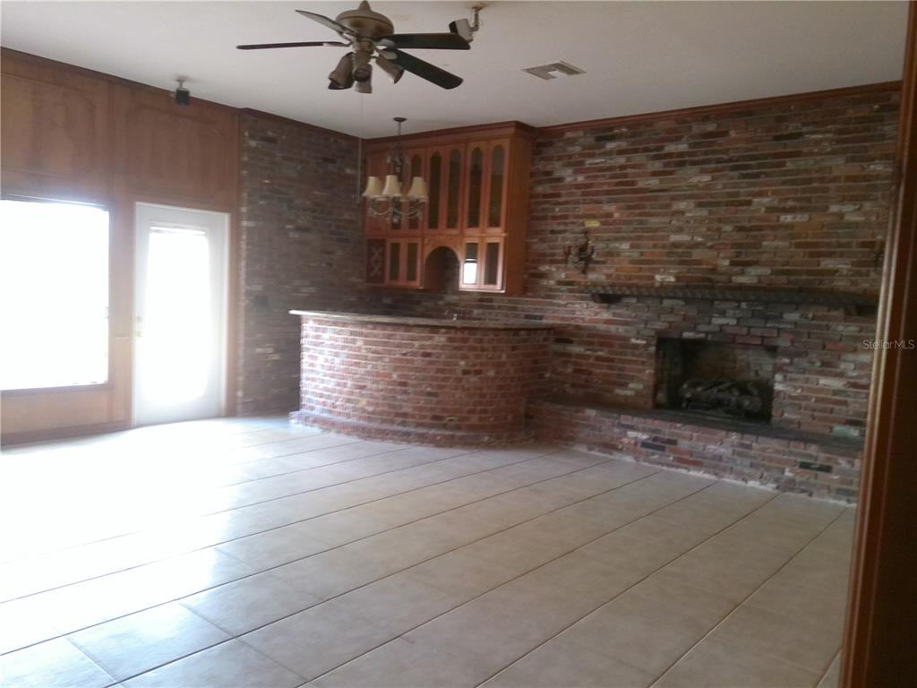 3821 East Osceola Road Geneva, FL 32732 - Photo 27 of 37 a view of fireplace and window